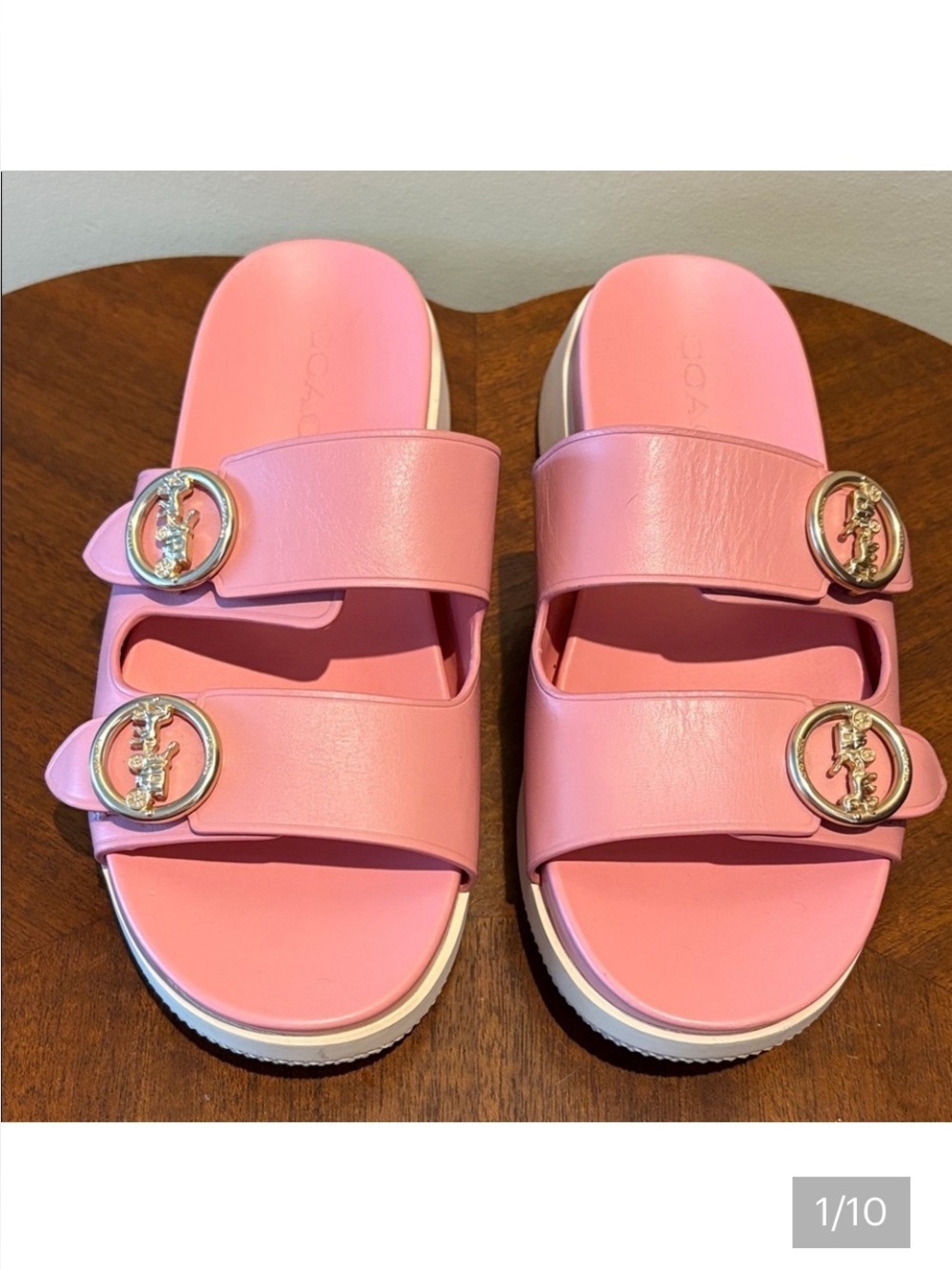 Coach  Pink Slide Sandals  gold horse carriage buttons  white bottom barely worn